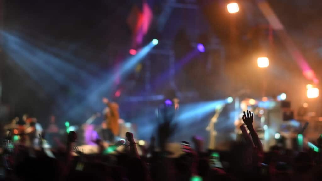 Motion blur summer music festival concert background.