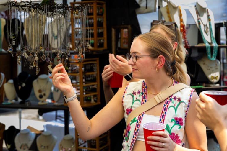 Manayunk Stroll After Hours woman looking at jewelry